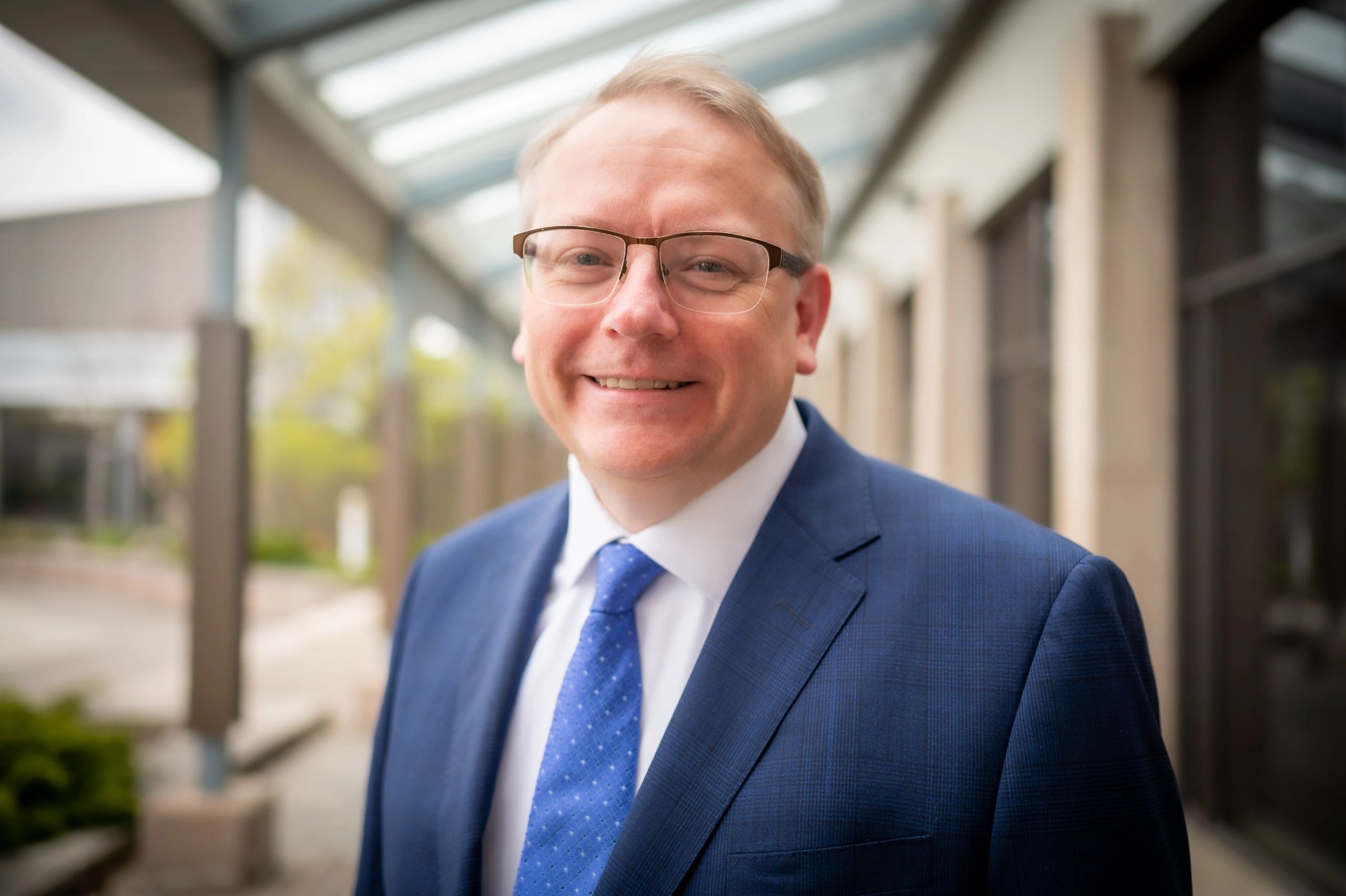 Canada Finance Ventures leader in a blue suit